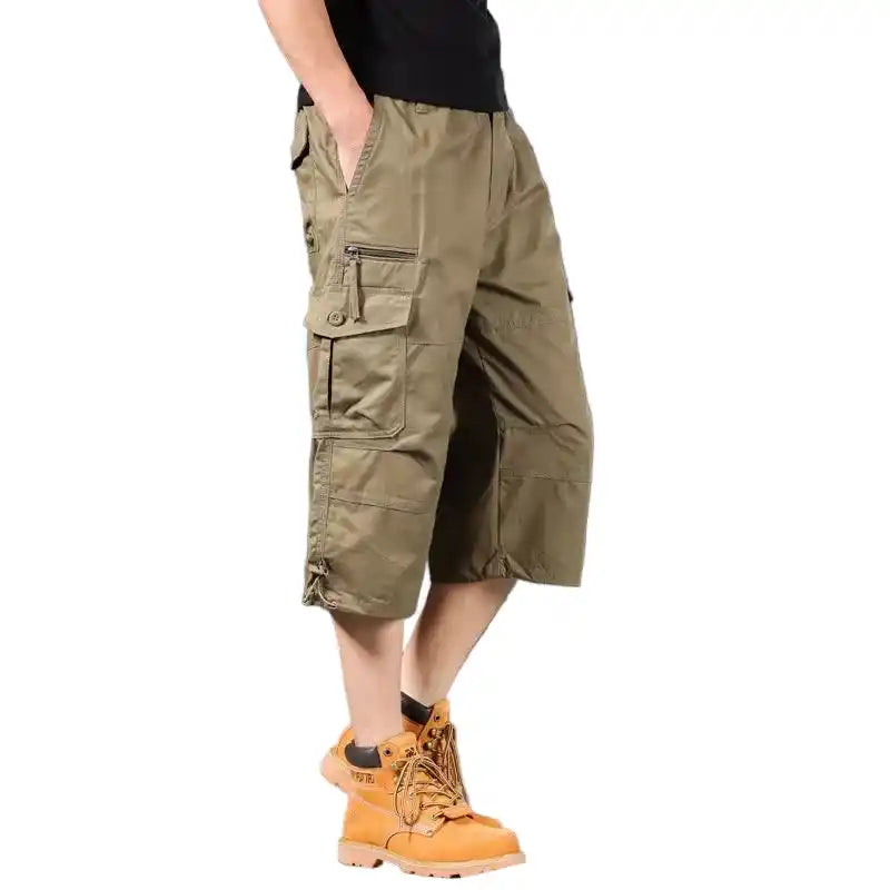 Khaki summer men's cargo shorts with below-knee length, elastic waistband, and utility pockets for casual outdoor activities.
