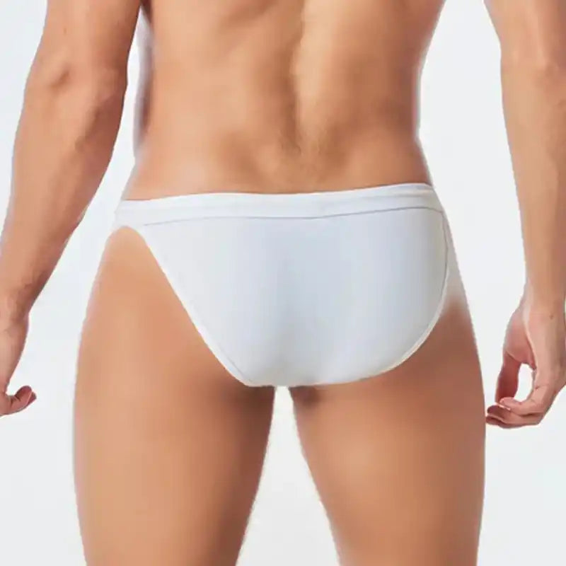 Back view of white low waist men's swim briefs with seamless stretch fit and soft nylon fabric. Perfect for beach and swim activities.