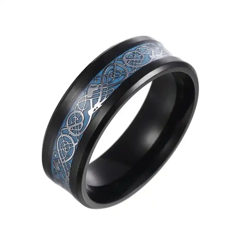 Engravable Dragon Spinner Ring featuring a blue glow-in-the-dark Celtic dragon design on a black titanium band. Stylish and calming fidget accessory.