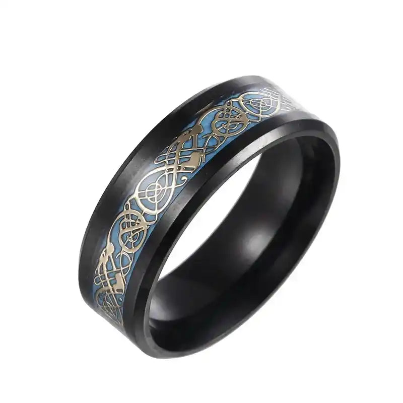 Titanium Dragon Spinner Ring with gold-accented Celtic dragon pattern on a black band. Engravable and ideal for gothic and fidget ring collections.