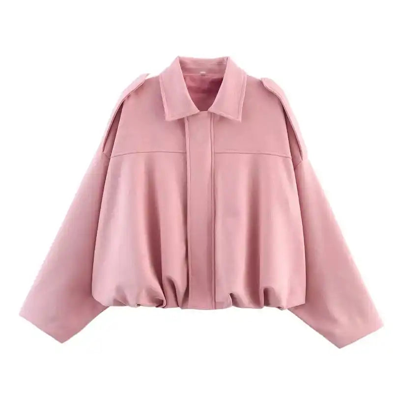 Light pink suede oversize women’s bomber jacket with zip front and drop shoulders, a soft-toned coat for spring fashion.