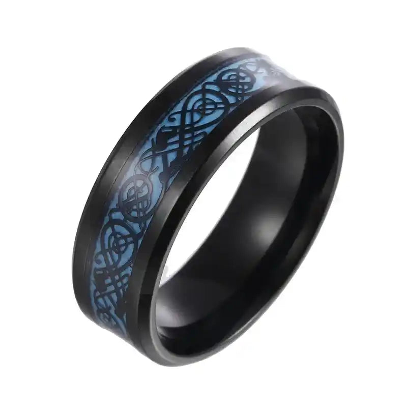 Glow-in-the-dark titanium Dragon Spinner Ring with black band and blue Celtic dragon design. Customizable and perfect for gothic jewelry lovers.