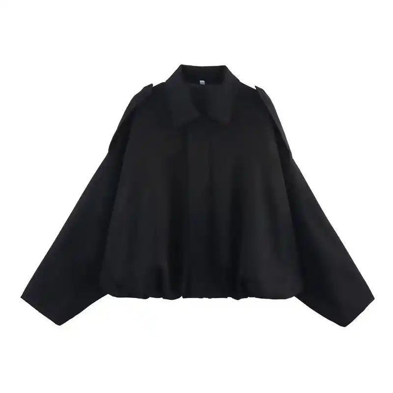 Black suede oversize women’s bomber jacket with a minimalist design and zip front, ideal for modern streetwear layering.