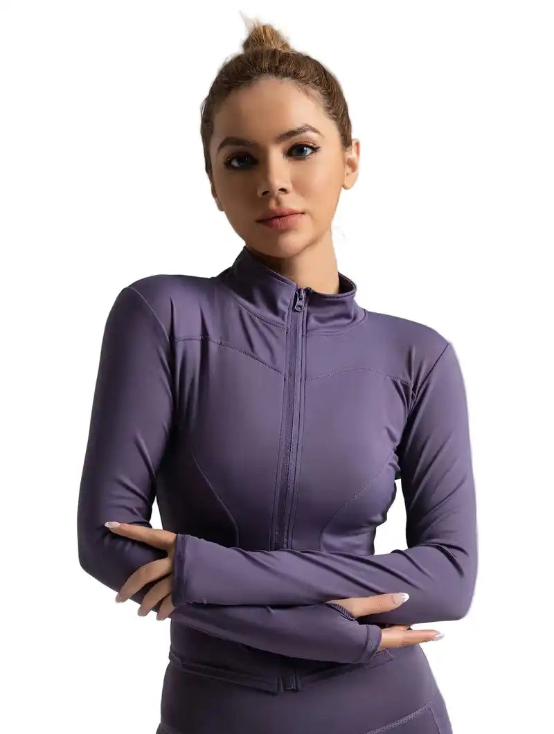 Purple women's tight-fitting yoga jacket with high collar and thumb holes, designed for active sports and sun protection.