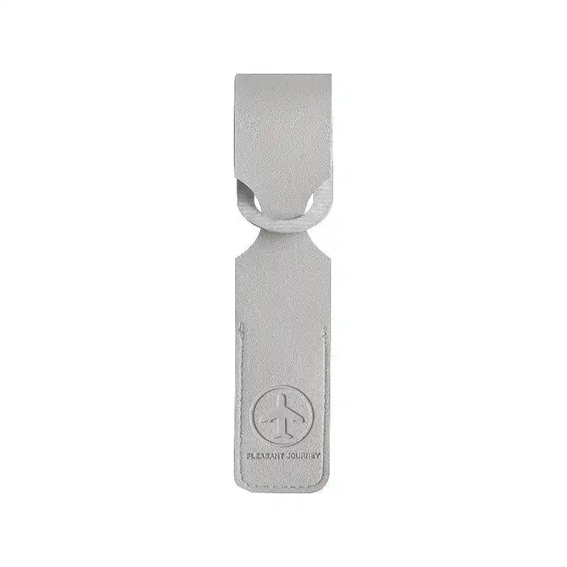 Gray PU leather luggage tag with airplane logo and loop strap. Functional ID/address holder for suitcases and travel bags.