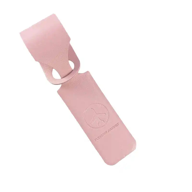 Pink PU leather luggage tag with secure strap and logo. Lightweight ID/address holder for suitcases and travel bags.