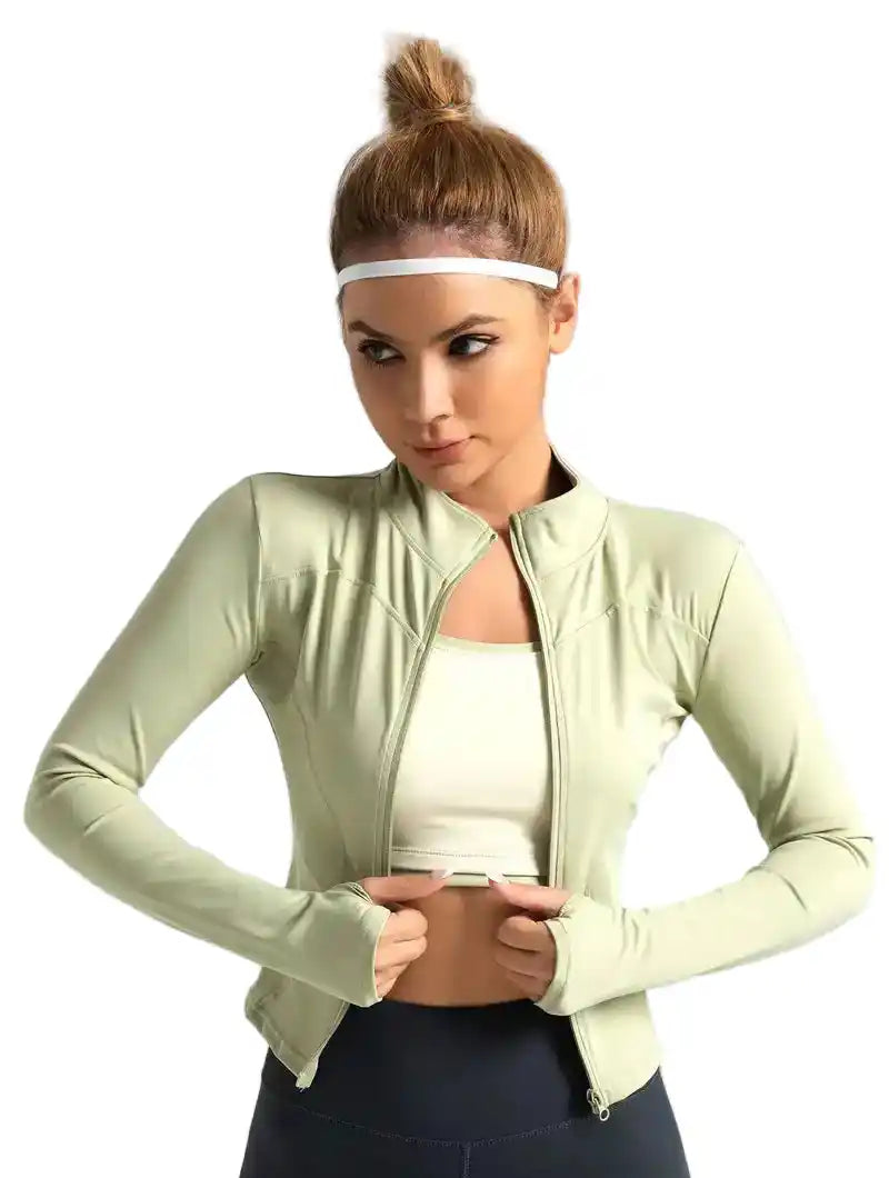 Light green women's long-sleeved yoga jacket with zip-up front and cropped fit, ideal for stylish fitness and running wear.