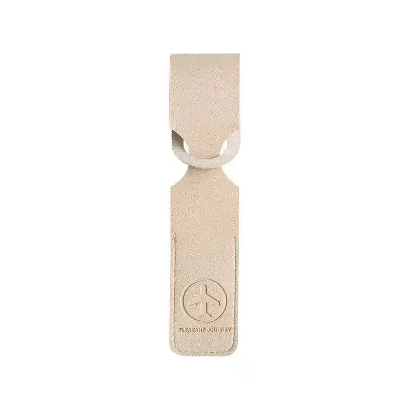 Beige PU leather luggage tag with airplane logo and loop strap. Lightweight ID/address holder for travel bags and suitcases.