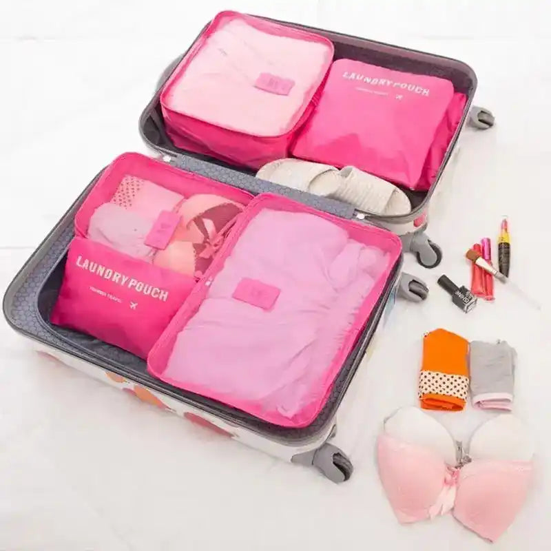 6PC Travel Storage Set in pink waterproof Oxford fabric neatly packed in a suitcase, ideal for organizing clothes, underwear, and makeup.
