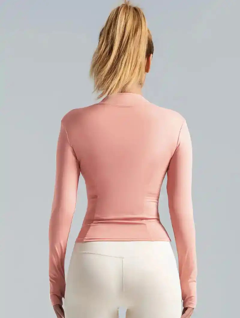 Back view of pink women's yoga sports jacket with long sleeves and contoured fit, ideal for activewear and sun protection.