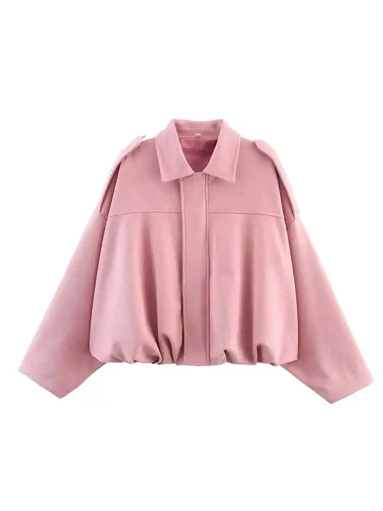 Pink suede oversize women’s bomber jacket with zip front, drop shoulders, and gathered hem, ideal for spring streetwear looks.