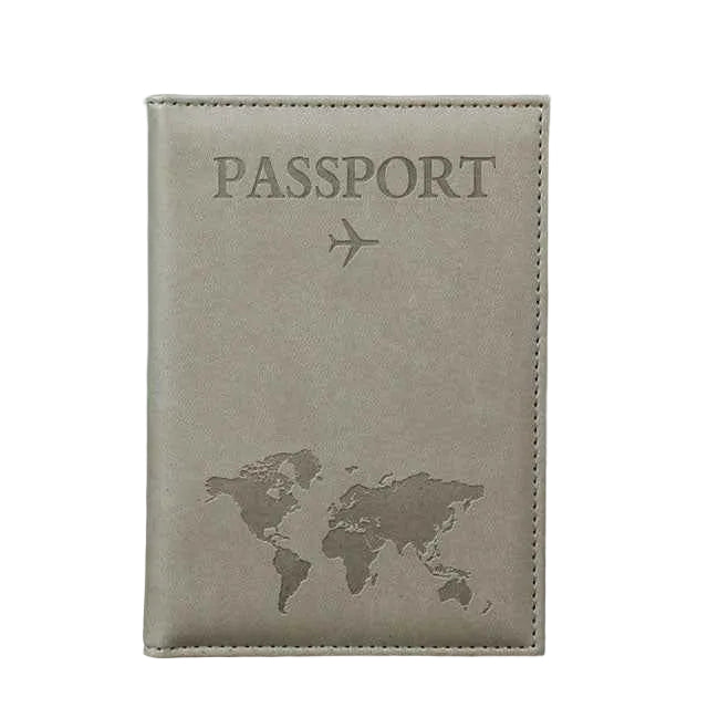 Beige passport holder with world map and airplane icon on a wooden surface and gray background