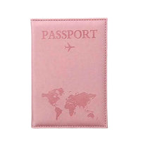Pink passport holder with world map design on a gray background