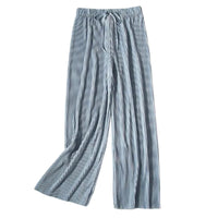 Striped pants on a white background with a photo and flowers.