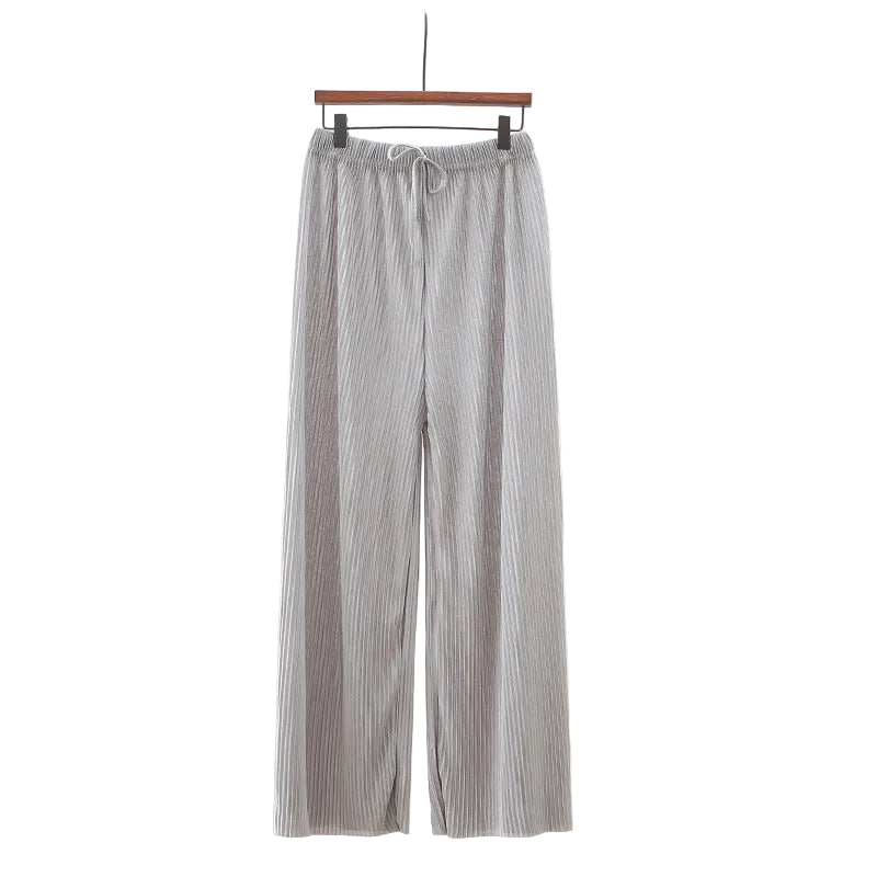 Striped pants hanging on a hanger against a white background