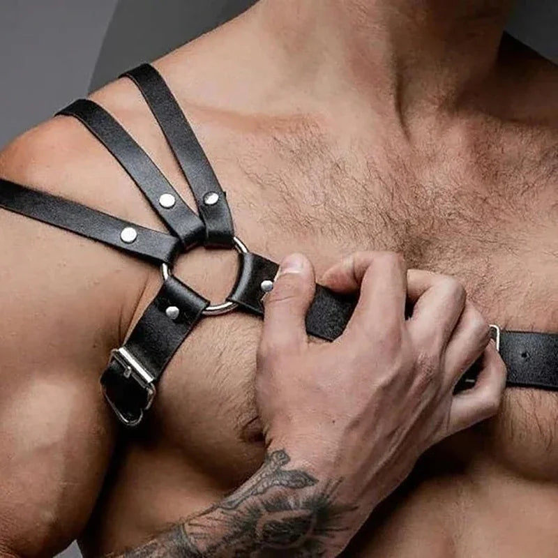 Close-up of men's body restraint strap with hand