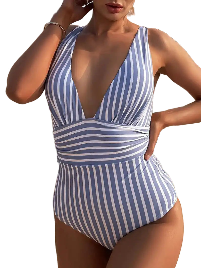 Blue and white striped V-neck one-piece vintage swimsuit with contouring fit. Stylish retro swimwear for women’s summer wardrobe.