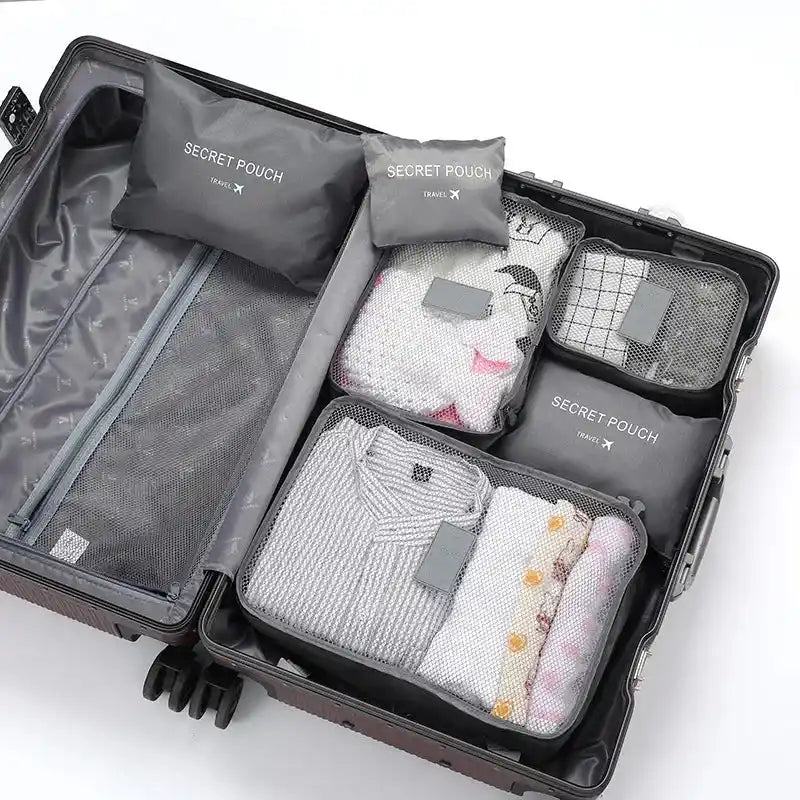 Grey 6PC Travel Storage Set in suitcase with mesh tops for visibility, perfect for organizing travel essentials in waterproof Oxford fabric.